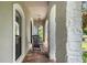 Charming front porch with rocking chairs and brick tile flooring at 1451 Lyndale Blvd, Winter Park, FL 32789