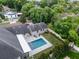 Rectangular pool with gray tile, surrounded by a patio at 1451 Lyndale Blvd, Winter Park, FL 32789