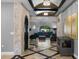 Spacious entryway with stone wall, wine cellar access, and views to living area at 1451 Lyndale Blvd, Winter Park, FL 32789