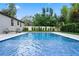 Refreshing swimming pool with surrounding patio at 1451 Lyndale Blvd, Winter Park, FL 32789