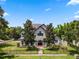 Two-story house with a double front door and landscaped yard at 1451 Lyndale Blvd, Winter Park, FL 32789