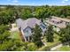 Two-story house with gray roof, pool, and large backyard at 1451 Lyndale Blvd, Winter Park, FL 32789