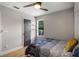 Bright bedroom with a murphy bed, hardwood floors, and a modern door at 1451 Lyndale Blvd, Winter Park, FL 32789