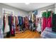 Room with multiple clothing racks and storage containers at 1451 Lyndale Blvd, Winter Park, FL 32789
