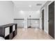 Upstairs hallway with hardwood floors and modern metal railing at 1451 Lyndale Blvd, Winter Park, FL 32789