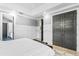 Main bedroom with attached bathroom, wood floors, and dark gray doors at 1451 Lyndale Blvd, Winter Park, FL 32789