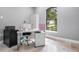 Home office with built-in desk and ample natural light at 1451 Lyndale Blvd, Winter Park, FL 32789
