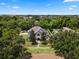 Large two-story house with gray roof, pool, and expansive lawn at 1451 Lyndale Blvd, Winter Park, FL 32789