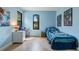 Charming bedroom with light blue walls and hardwood floors at 1451 Lyndale Blvd, Winter Park, FL 32789