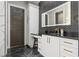Modern bathroom with marble tile and a large vanity at 1451 Lyndale Blvd, Winter Park, FL 32789