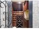 Custom wine cellar features wooden racks and a stone accent wall at 1451 Lyndale Blvd, Winter Park, FL 32789