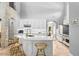 Gourmet kitchen with white cabinets, large island, and high-end appliances at 1451 Lyndale Blvd, Winter Park, FL 32789