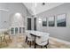 Bright dining room with marble table and modern chairs at 1451 Lyndale Blvd, Winter Park, FL 32789