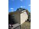 House side with AC unit and storage at 3416 Unity Tree Dr, Edgewater, FL 32141
