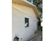 House side with exterior door and small window at 3416 Unity Tree Dr, Edgewater, FL 32141