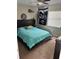 Bedroom with a platform bed and teal bedding at 3416 Unity Tree Dr, Edgewater, FL 32141