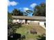 Single story house with a well-maintained lawn at 3416 Unity Tree Dr, Edgewater, FL 32141