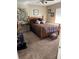 Bedroom with a wooden bed frame and carpeted floor at 3416 Unity Tree Dr, Edgewater, FL 32141