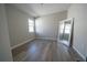 Bedroom with wood-look floors and a large mirror at 5237 Bee Balm St, Haines City, FL 33844