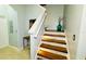 Elegant staircase with wood steps and ambient lighting at 2214 Calabria Ave, Davenport, FL 33897