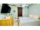 Bright bedroom with a king-size bed and plenty of light at 2214 Calabria Ave, Davenport, FL 33897