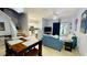 Open living room and kitchen with dining area and view to backyard at 2214 Calabria Ave, Davenport, FL 33897