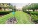 Landscaped community lawn with walking path at 2214 Calabria Ave, Davenport, FL 33897