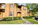 Townhouse exterior with walkway and landscaping at 2214 Calabria Ave, Davenport, FL 33897