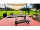 Community picnic area with table, grill, and shade at 2214 Calabria Ave, Davenport, FL 33897