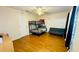 Bright bedroom with bunk beds, sofa, and wood floors at 2214 Calabria Ave, Davenport, FL 33897