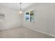 Simple dining area with light walls and tiled flooring at 4814 Terra Sole Pl, St Cloud, FL 34771