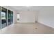 Open living room with tile flooring and access to a patio at 4814 Terra Sole Pl, St Cloud, FL 34771