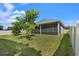 Landscaped backyard with covered patio at 4814 Terra Sole Pl, St Cloud, FL 34771