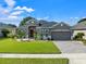 One-story house with a gray exterior and a two-car garage at 4814 Terra Sole Pl, St Cloud, FL 34771