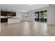 Bright living room with tile floors and sliding glass doors leading to the patio at 4814 Terra Sole Pl, St Cloud, FL 34771