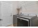 Laundry room with washer, dryer, and shelving at 4814 Terra Sole Pl, St Cloud, FL 34771