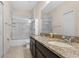 Bathroom with double vanity, granite countertops, and shower/tub combo at 4814 Terra Sole Pl, St Cloud, FL 34771