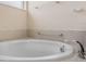 Oval soaking tub in a modern bathroom at 4814 Terra Sole Pl, St Cloud, FL 34771