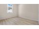 Bright bedroom featuring wood-look floors and a window at 4814 Terra Sole Pl, St Cloud, FL 34771
