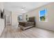 Spacious bedroom with wood-look flooring and a ceiling fan at 4814 Terra Sole Pl, St Cloud, FL 34771