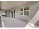 Spacious covered patio with tile flooring and sliding glass doors at 4814 Terra Sole Pl, St Cloud, FL 34771