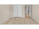 Bedroom with wood-look floors and access to a bathroom at 4814 Terra Sole Pl, St Cloud, FL 34771