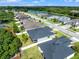 Aerial view of neighborhood with lake at 4814 Terra Sole Pl, St Cloud, FL 34771