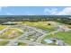 Aerial view of a residential community with houses and a pool at 33311 Rembrandt Ln, Sorrento, FL 32776