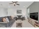 Comfortable living room featuring a cozy sofa set and plenty of natural light at 33311 Rembrandt Ln, Sorrento, FL 32776