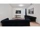 Living area with two sofas and a mounted TV at 7513 Marker Ave, Kissimmee, FL 34747