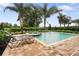 Inviting backyard oasis with a refreshing pool and spa at 7513 Marker Ave, Kissimmee, FL 34747