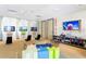 Indoor play area with games and TVs at 7513 Marker Ave, Kissimmee, FL 34747