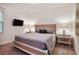 Spacious bedroom with a king-size bed, nightstands, and TV at 7513 Marker Ave, Kissimmee, FL 34747