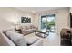 Comfortable living room with sliding glass doors leading to a patio at 7513 Marker Ave, Kissimmee, FL 34747